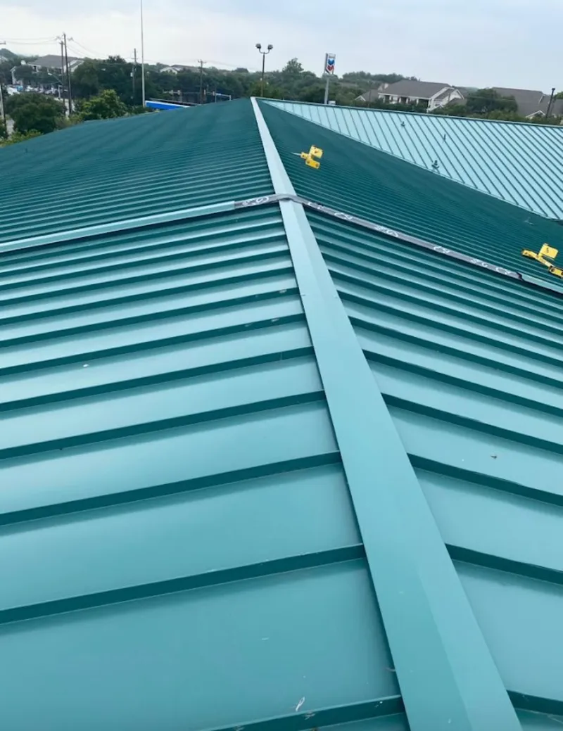 Green commercial metal roof ridge and valley for Metal Roof Repair in Osceola